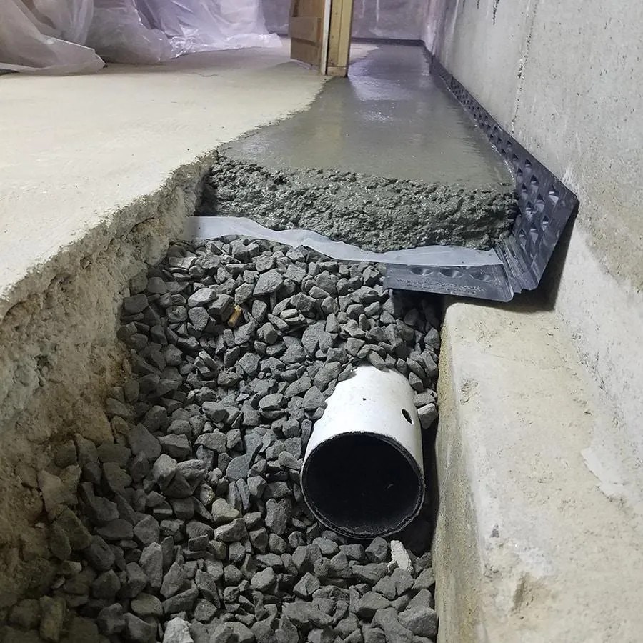 Interior perimeter drain system installation — Outlaw Drainage